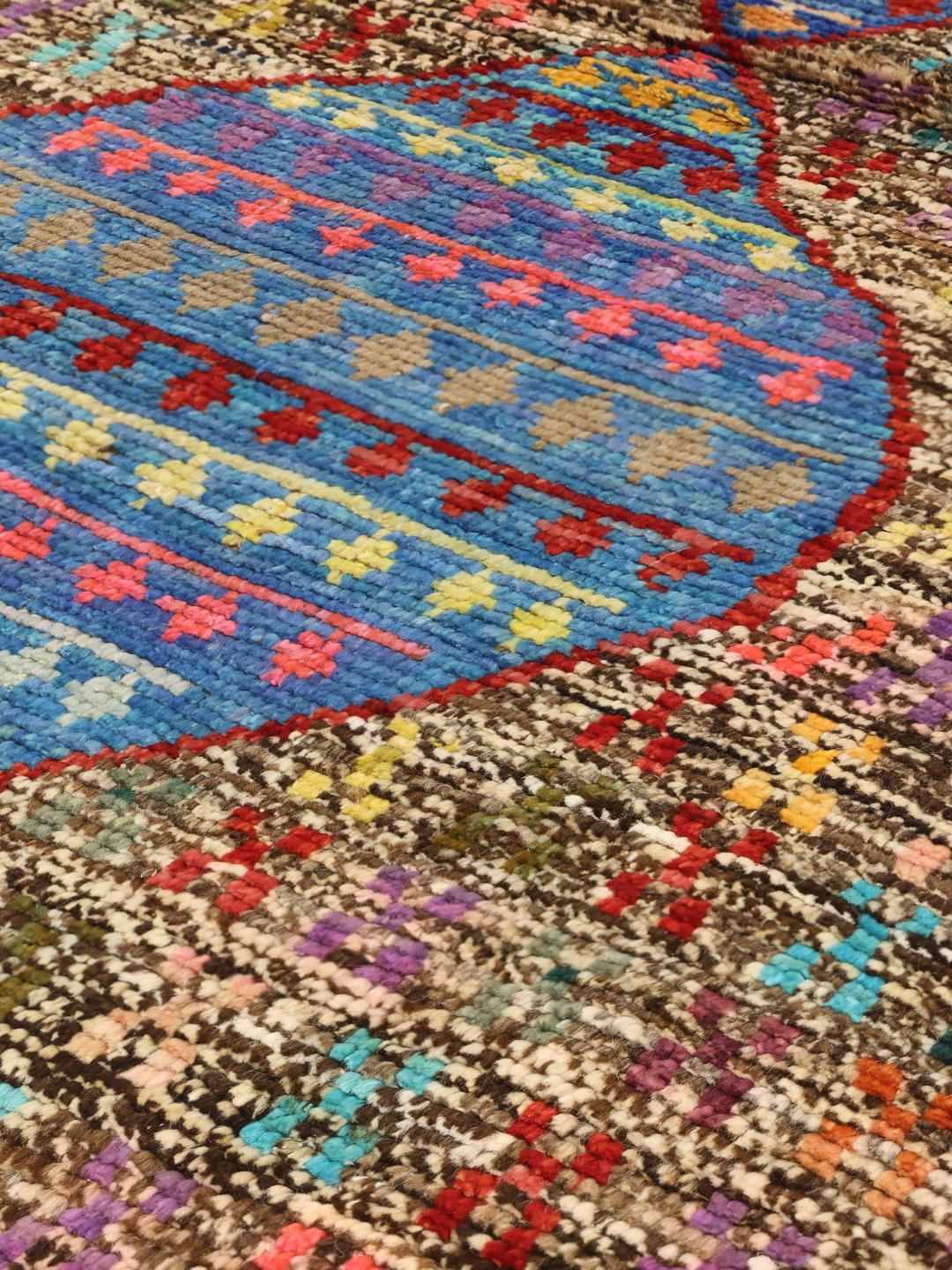 Håndlavet afghansk uldtæppe i flerfarvet design