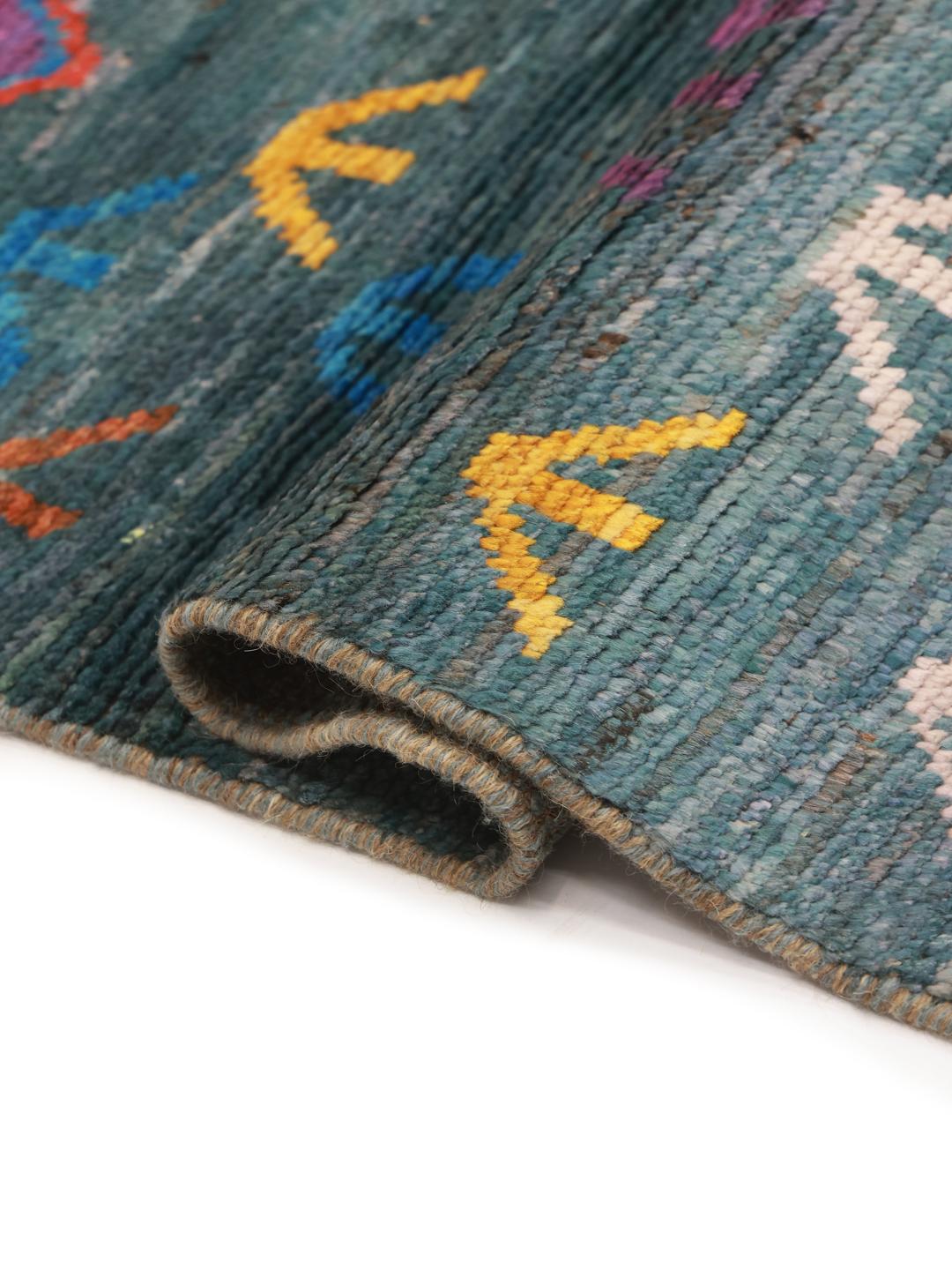 Handmade wool rug from Afghanistan in teal with colorful diamond patterns