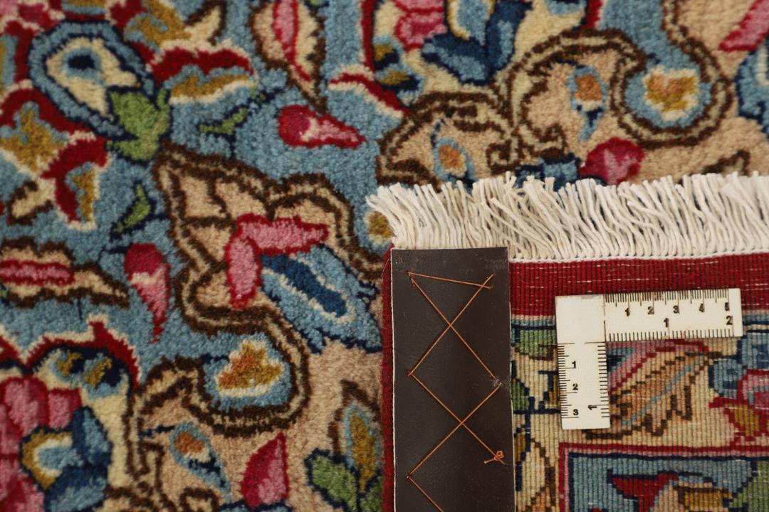 Handgeknoopt rood vloerkleed met traditionele motieven uit het Midden-Oosten van Kerman