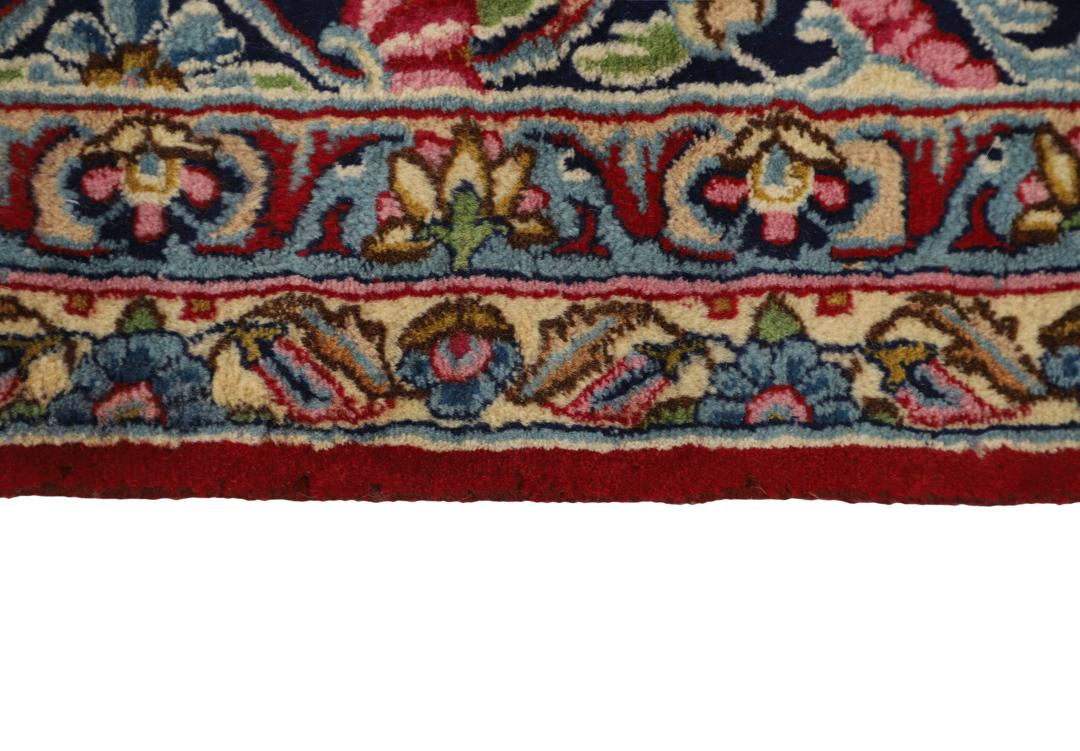 Handgeknoopt rood vloerkleed met traditionele motieven uit het Midden-Oosten van Kerman