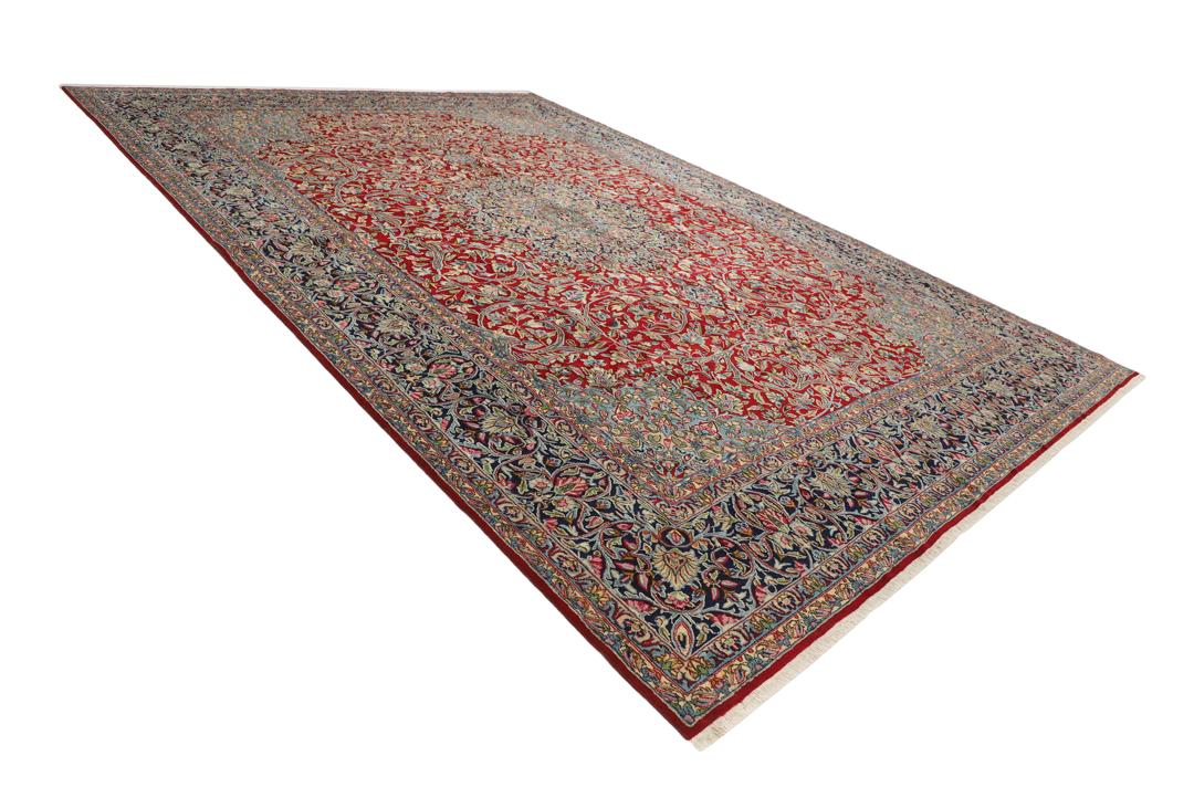 Handgeknoopt rood vloerkleed met traditionele motieven uit het Midden-Oosten van Kerman