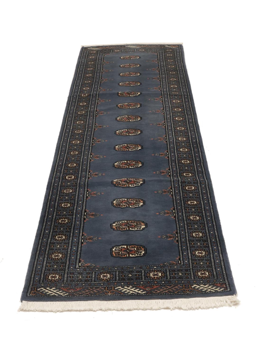 Handmade runner rug from Pakistan in blue with wool pile