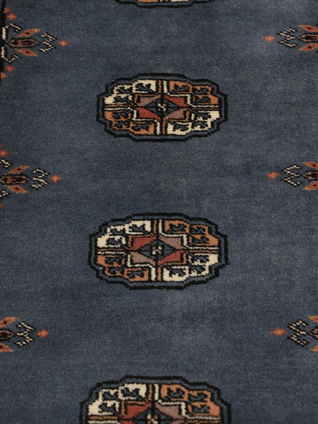 Handmade runner rug from Pakistan in blue with wool pile