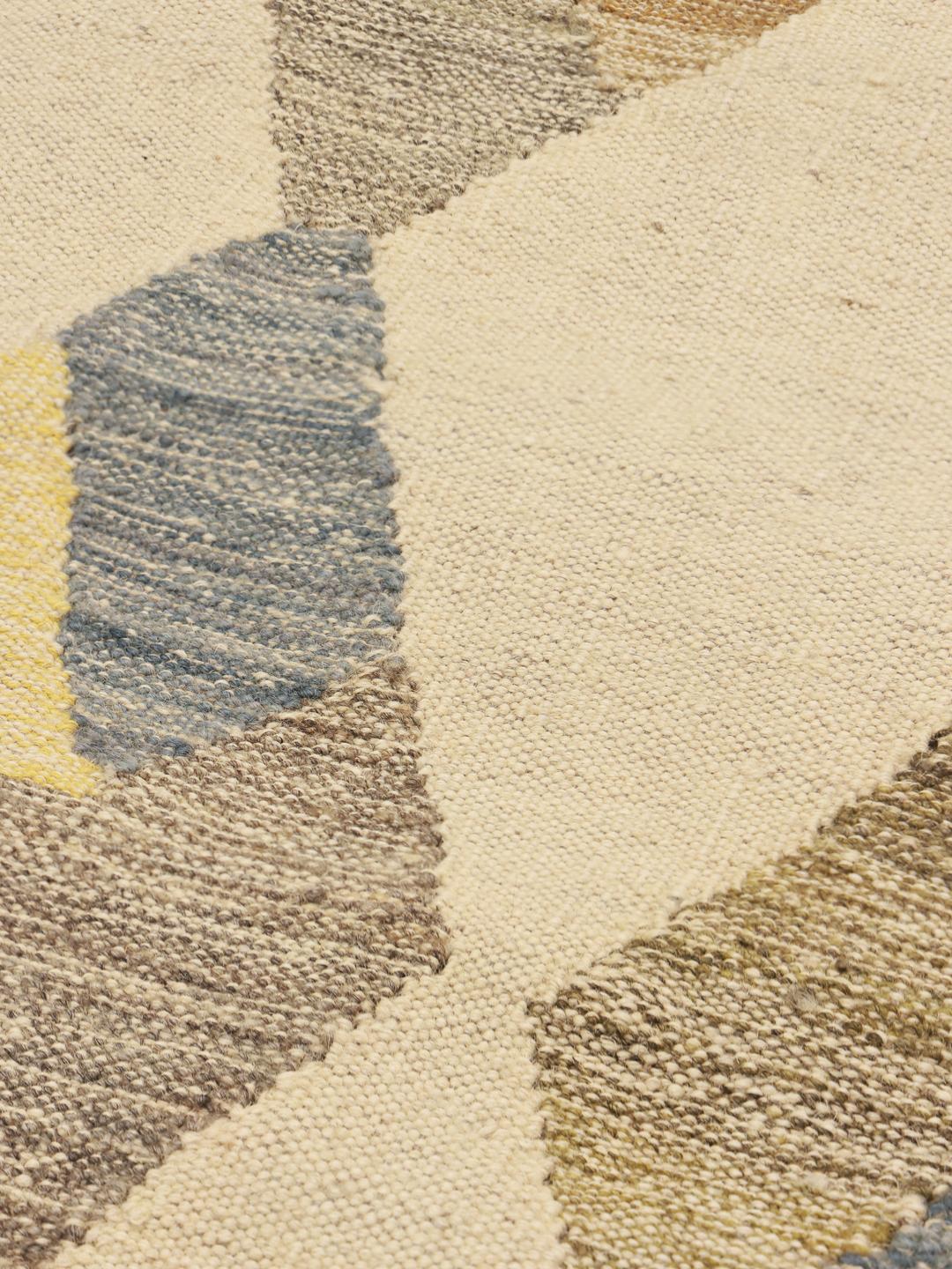 Hand-woven Afghan rug in beige