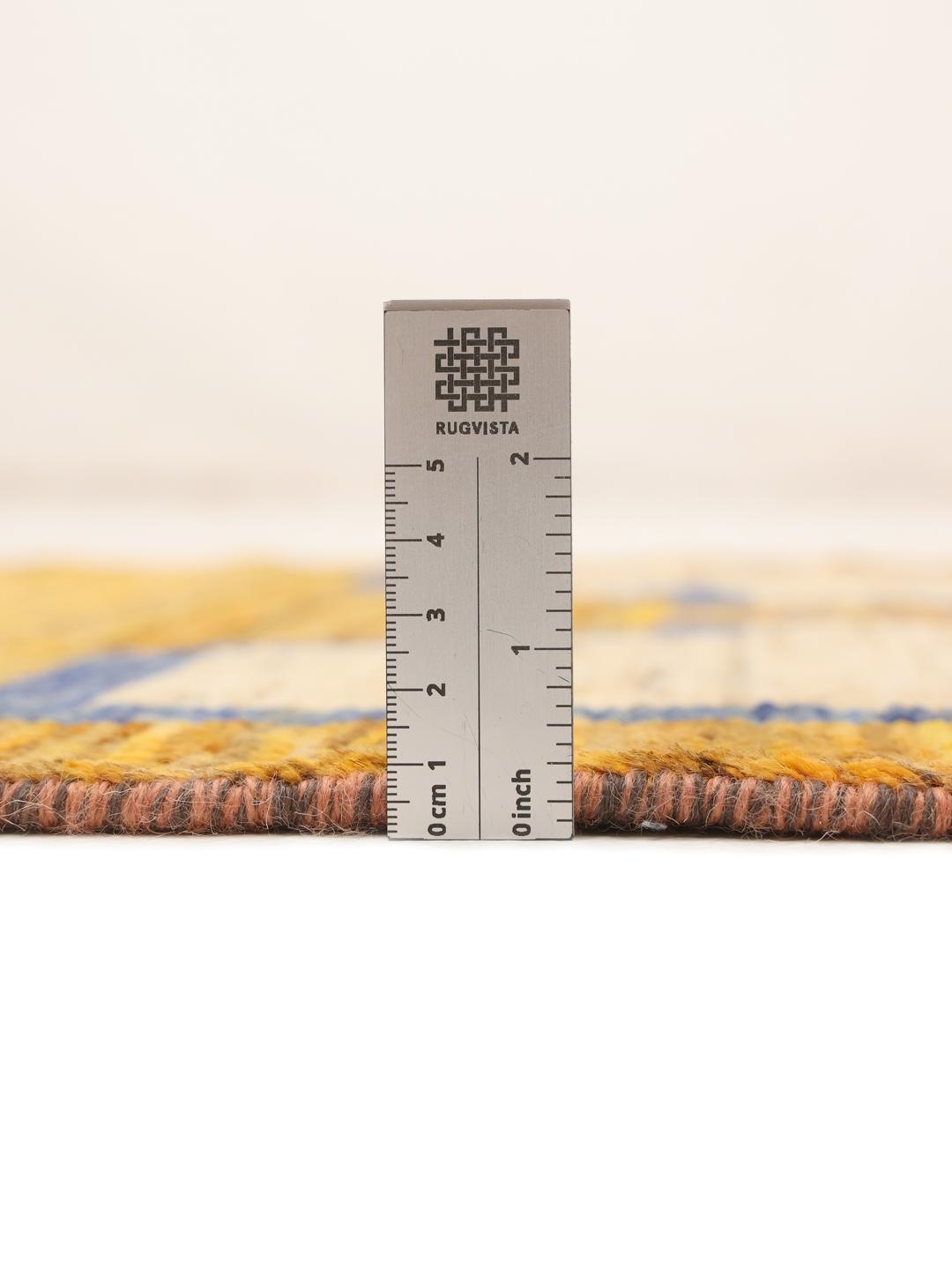 Håndknyttet løber fra Afghanistan med geometriske motiver i orange og blå.