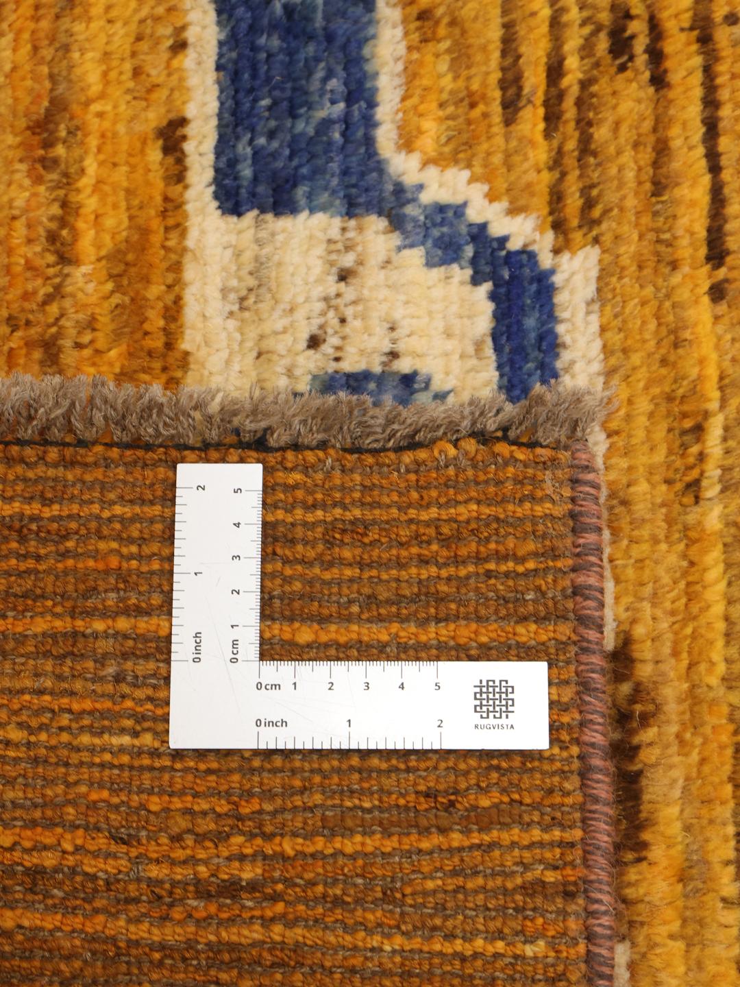 Håndknyttet løber fra Afghanistan med geometriske motiver i orange og blå.