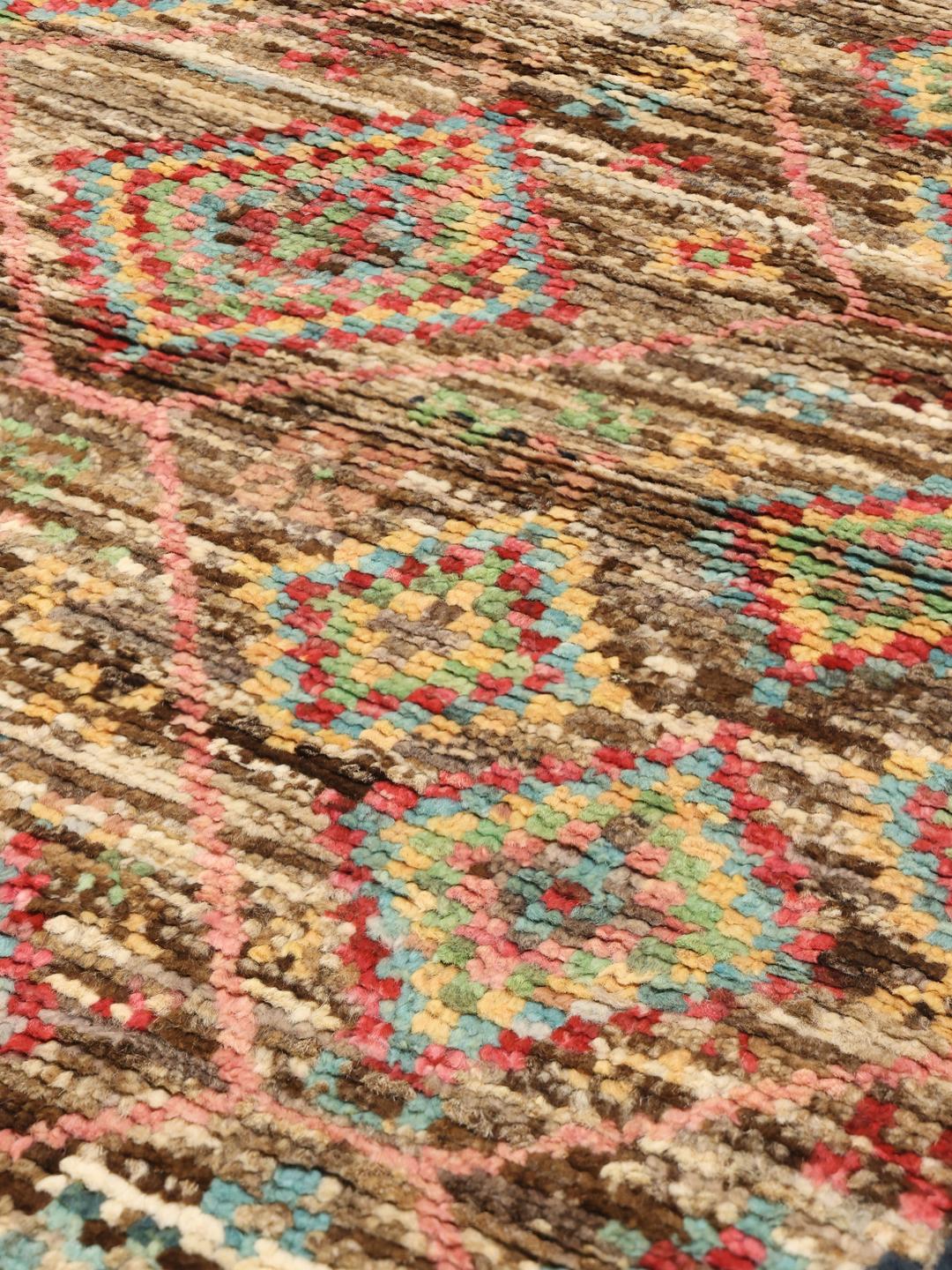 Hand-knotted Afghan rug with colourful geometric diamond patterns on a brown field