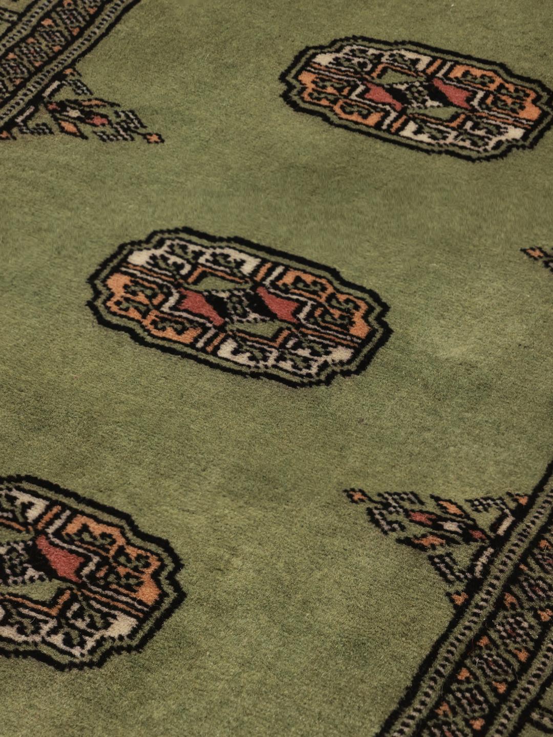Handmade green Bokhara runner rug from Pakistan