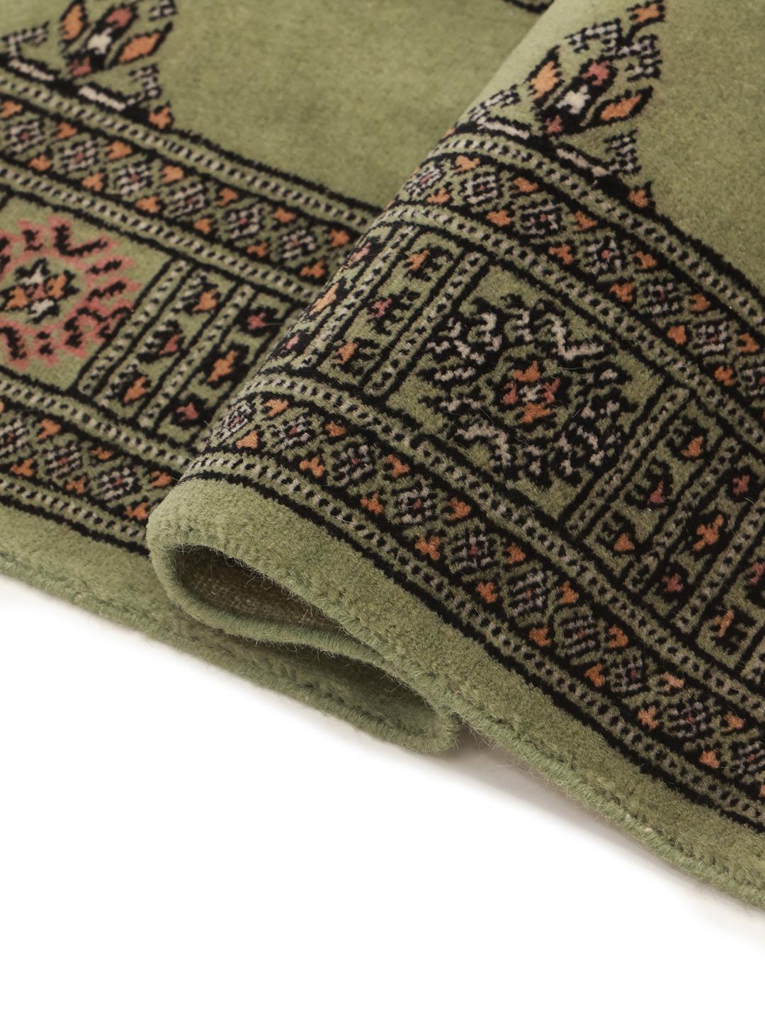 Handmade green Bokhara runner rug from Pakistan