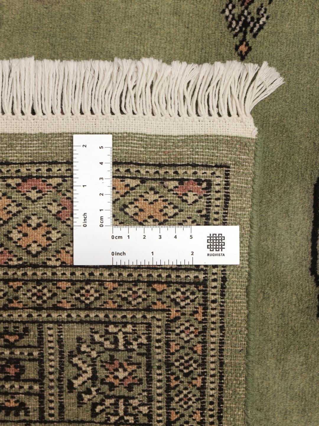 Handmade green Bokhara runner rug from Pakistan