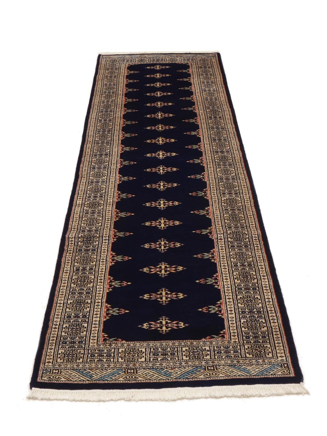 Handmade runner rug from Pakistan in dark-blue