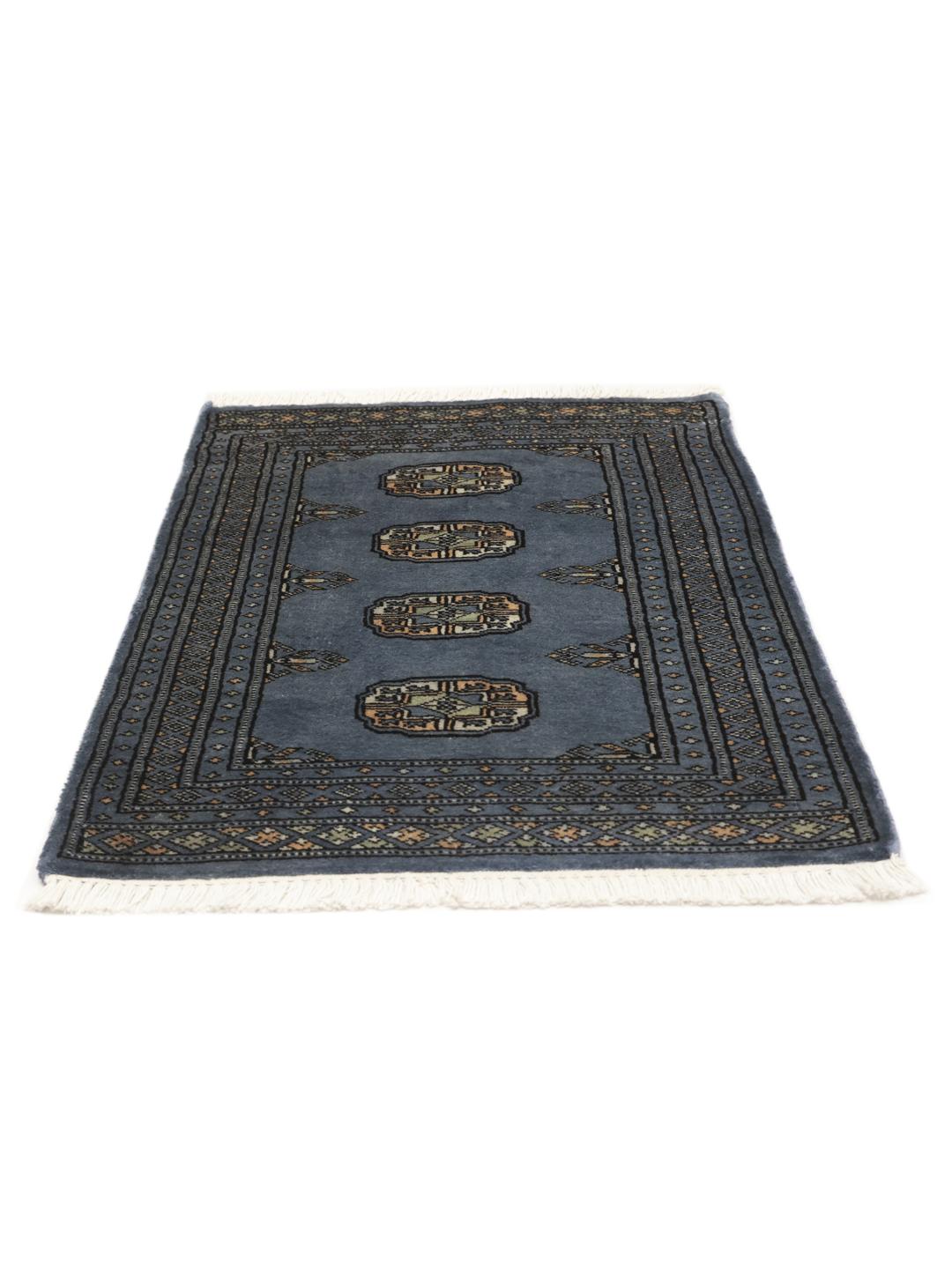 Handmade Pakistan Bokhara blue rug with traditional motifs