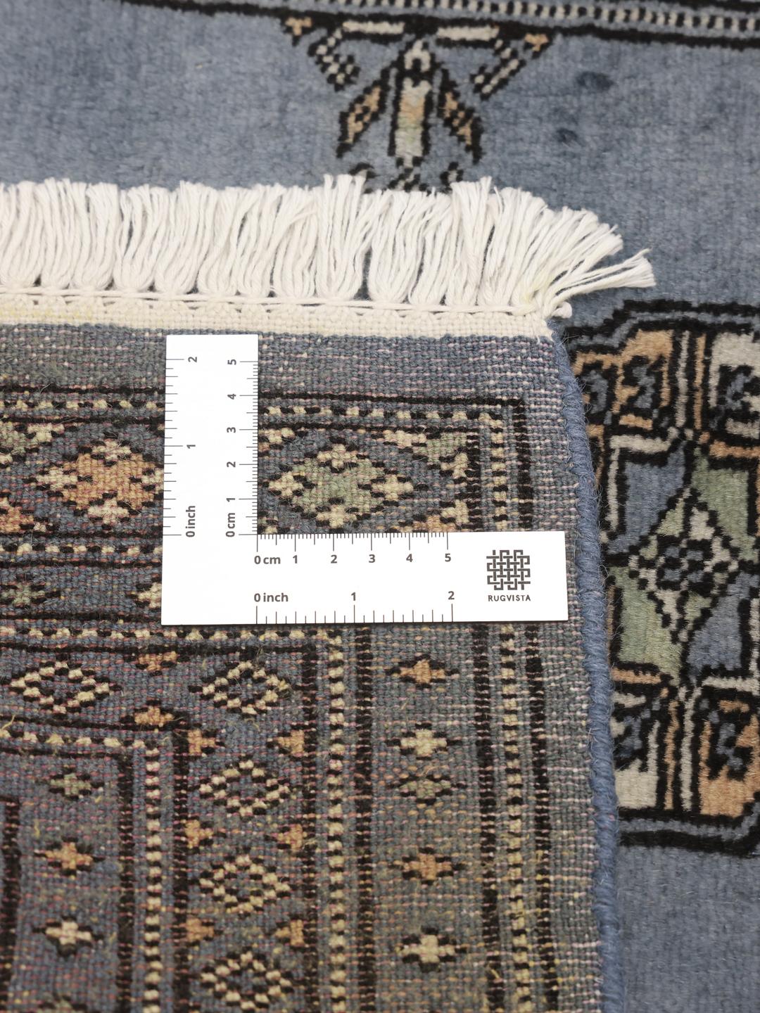 Handmade Pakistan Bokhara blue rug with traditional motifs