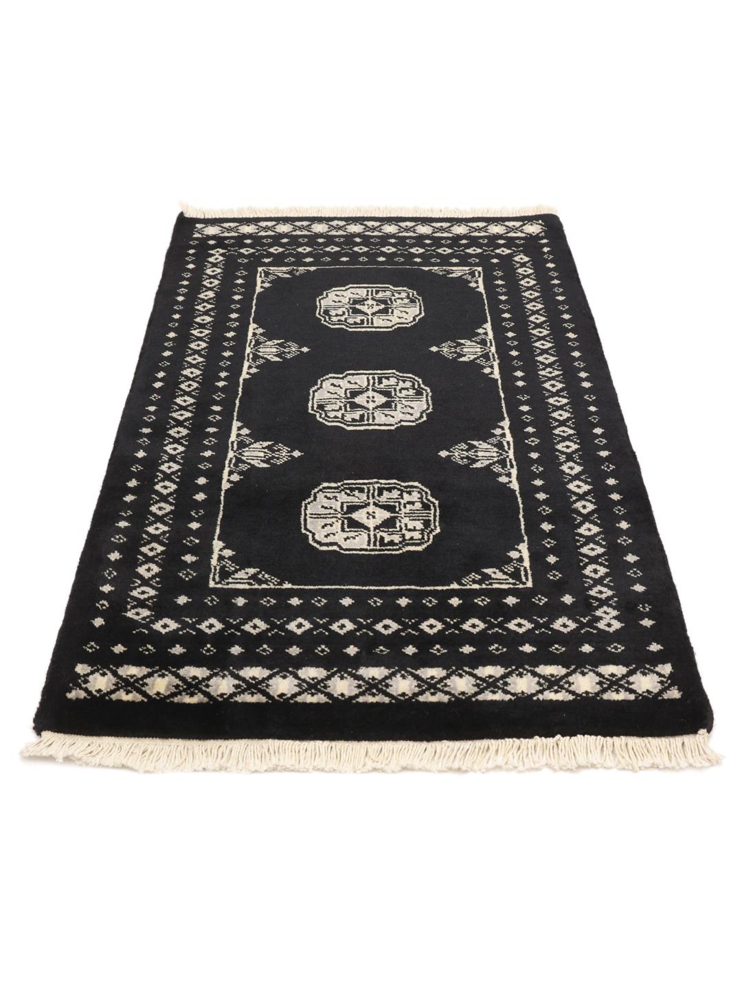 Hand-knotted Pakistan wool rug in black with traditional motifs