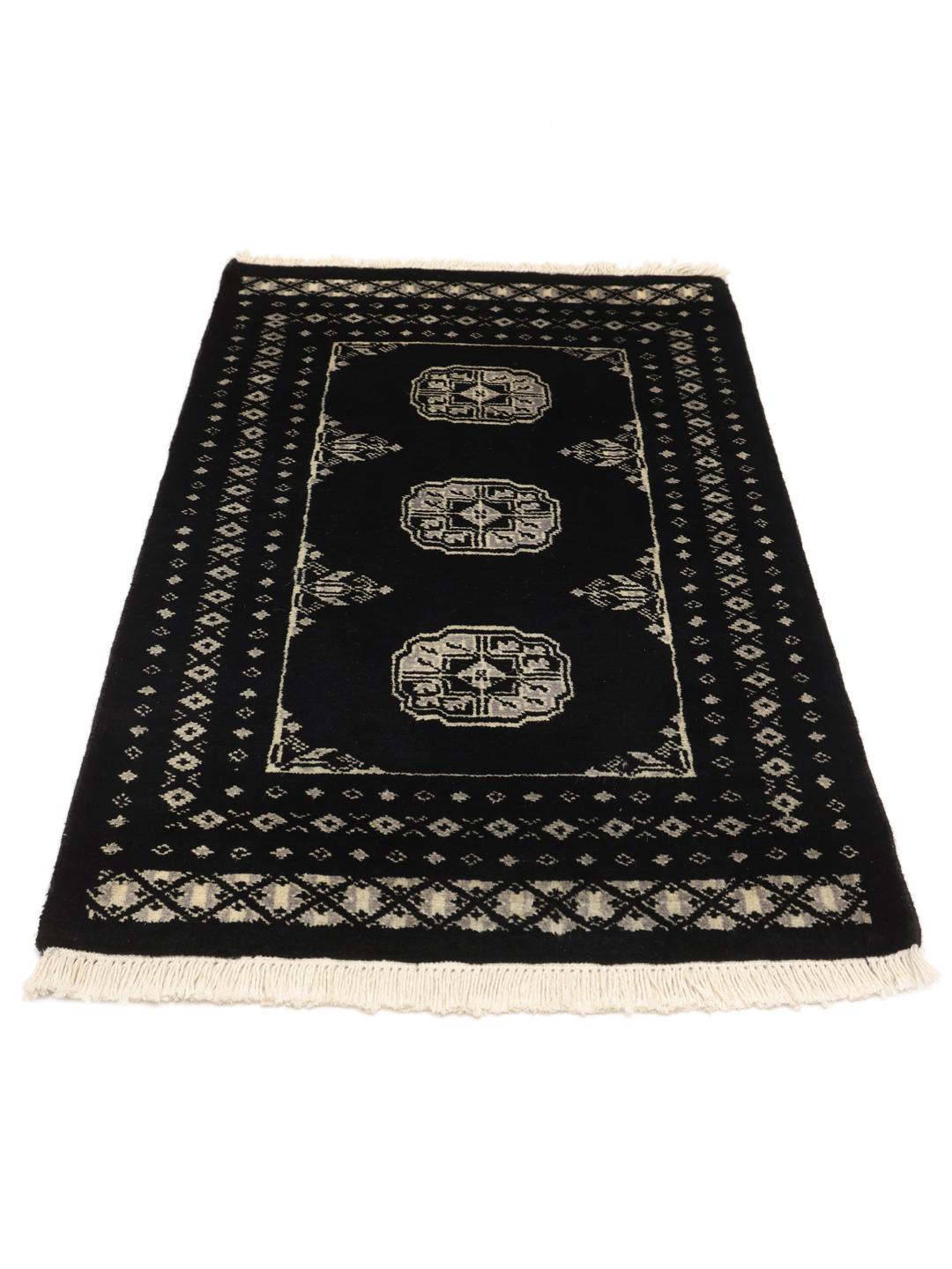 Hand-knotted Pakistan wool rug in black with traditional motifs