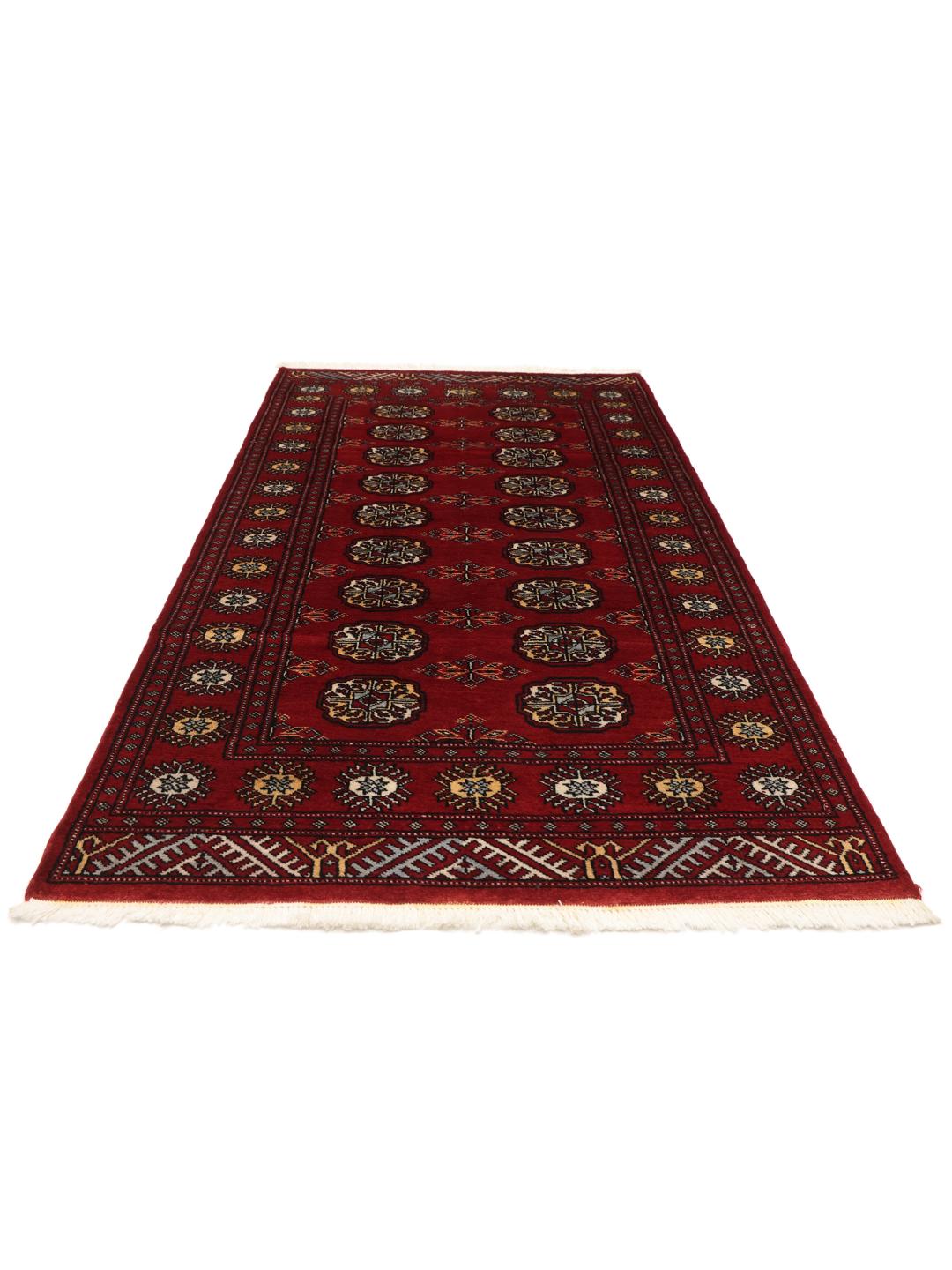Handmade Pakistan red rug with traditional motifs