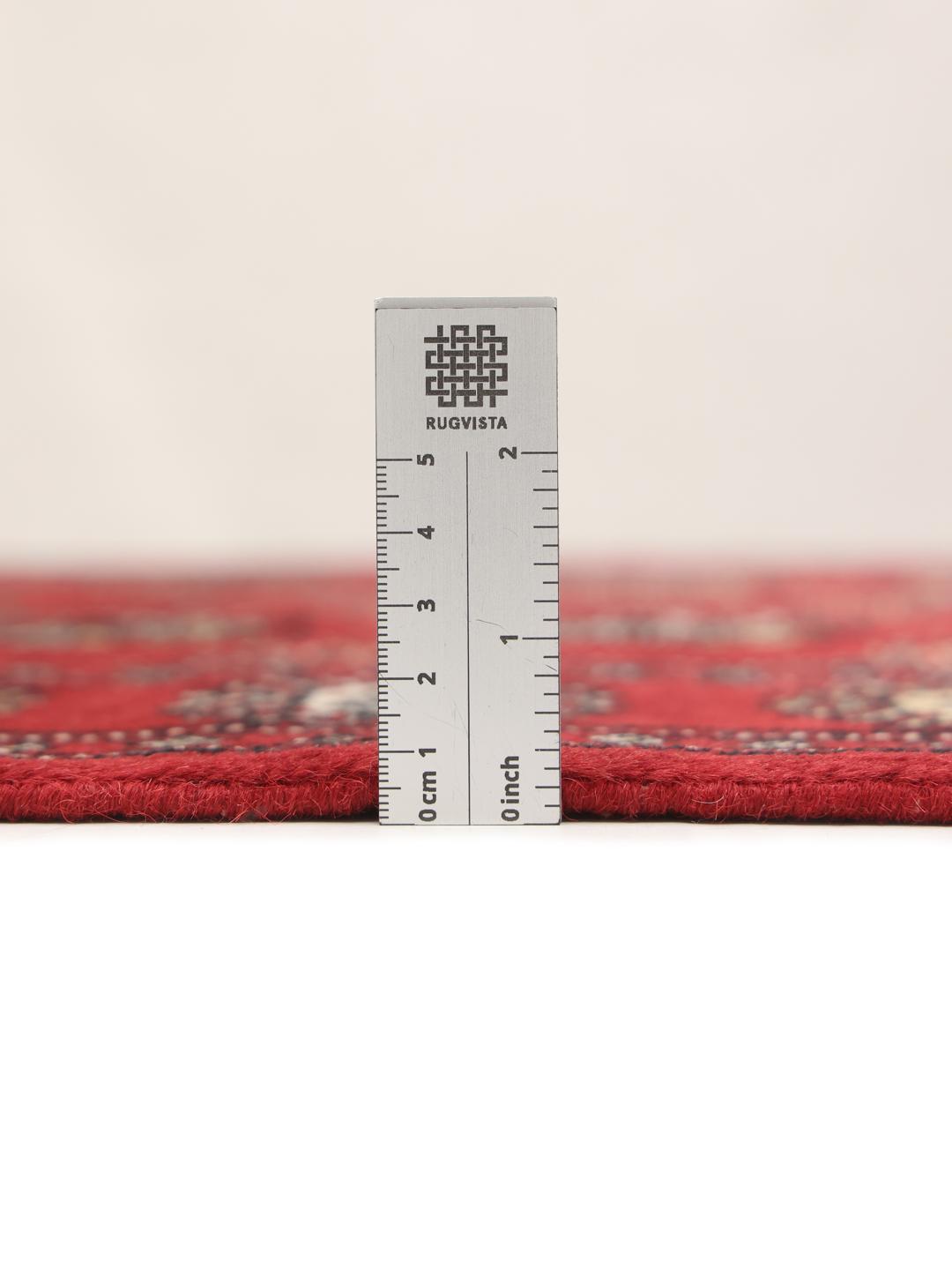 Handmade Pakistan red rug with traditional motifs