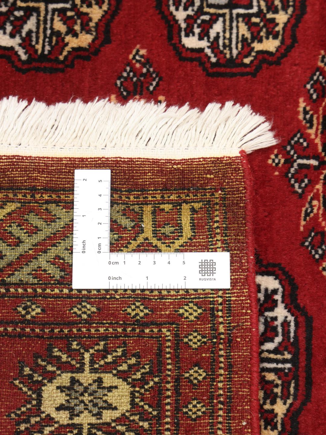 Handmade Pakistan red rug with traditional motifs