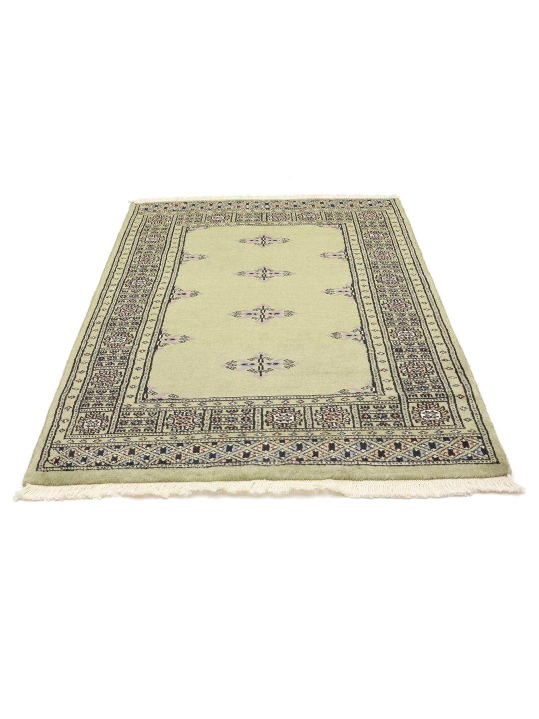 Handmade wool rug from Pakistan in green