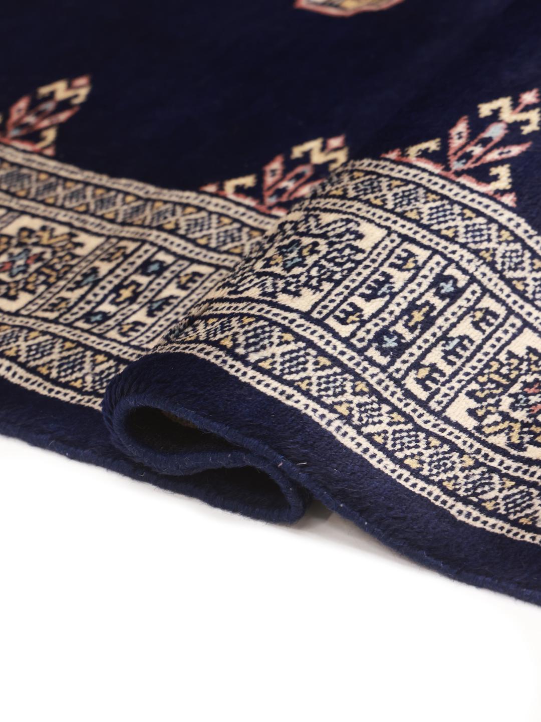 Handmade rug from Pakistan in dark blue