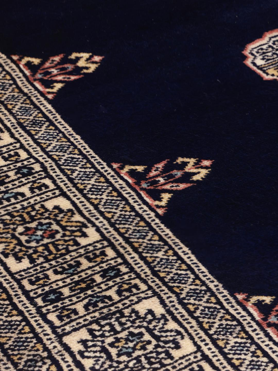 Handmade rug from Pakistan in dark blue