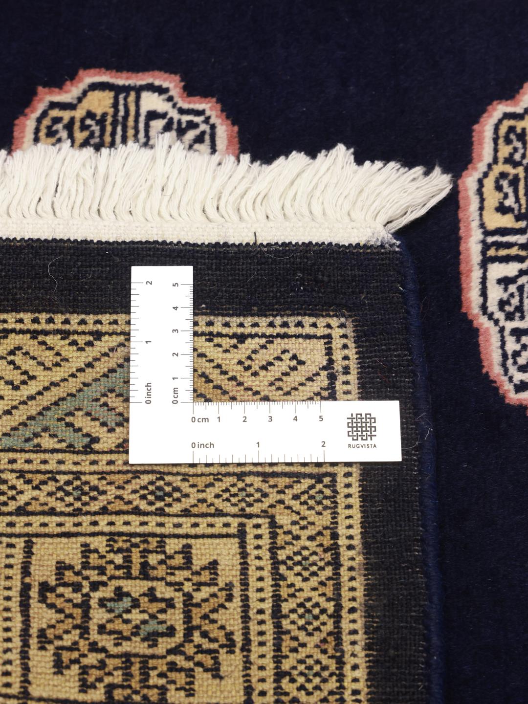 Handmade rug from Pakistan in dark blue