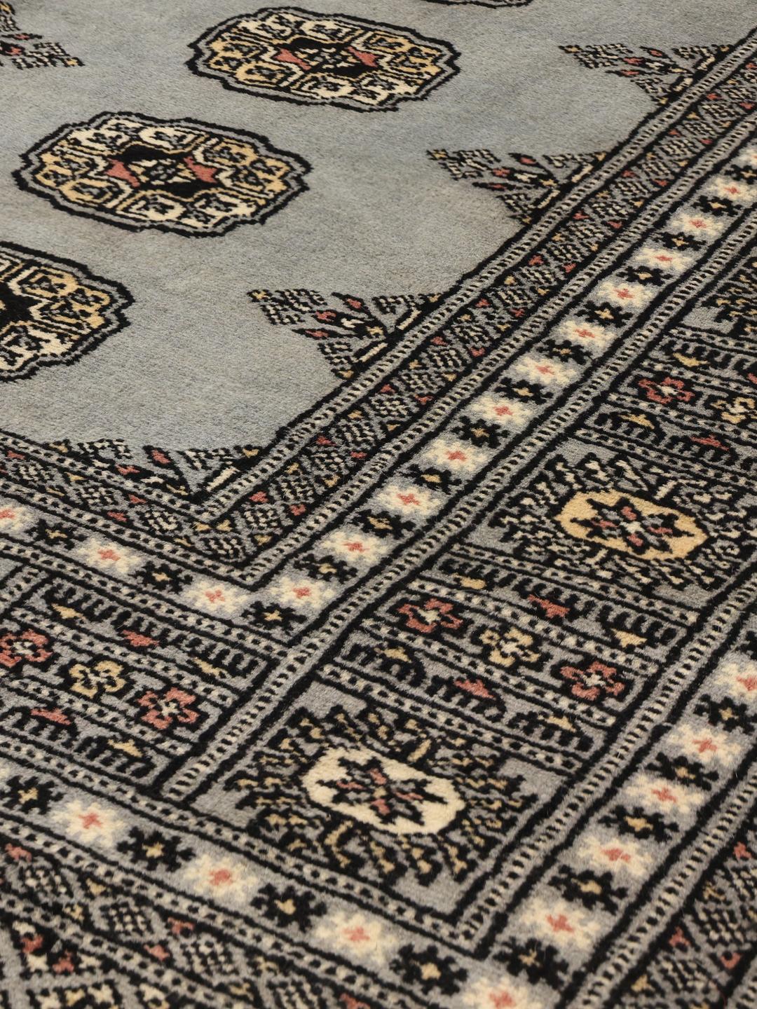Hand-knotted Pakistani Bokhara rug in blue