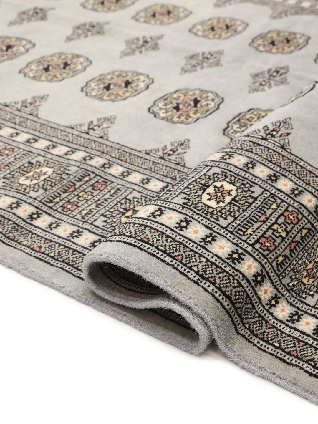 Hand-knotted Pakistani Bokhara rug in blue