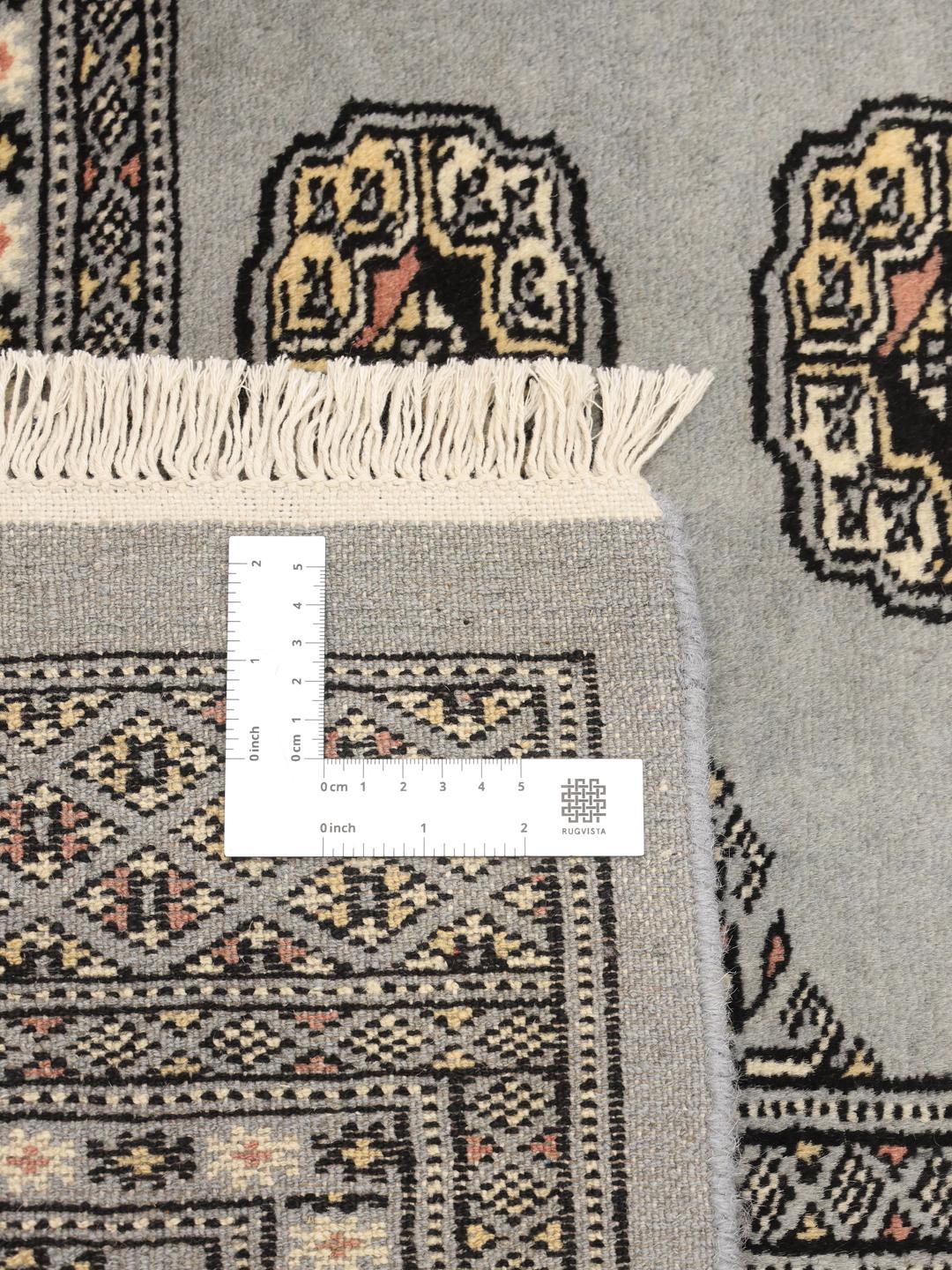Hand-knotted Pakistani Bokhara rug in blue