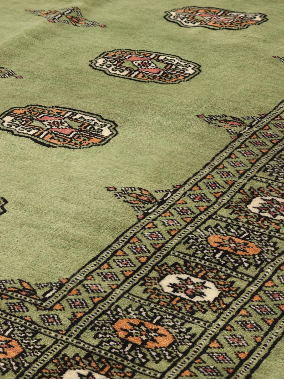 Tapis en laine pakistanaise noué à la main en vert