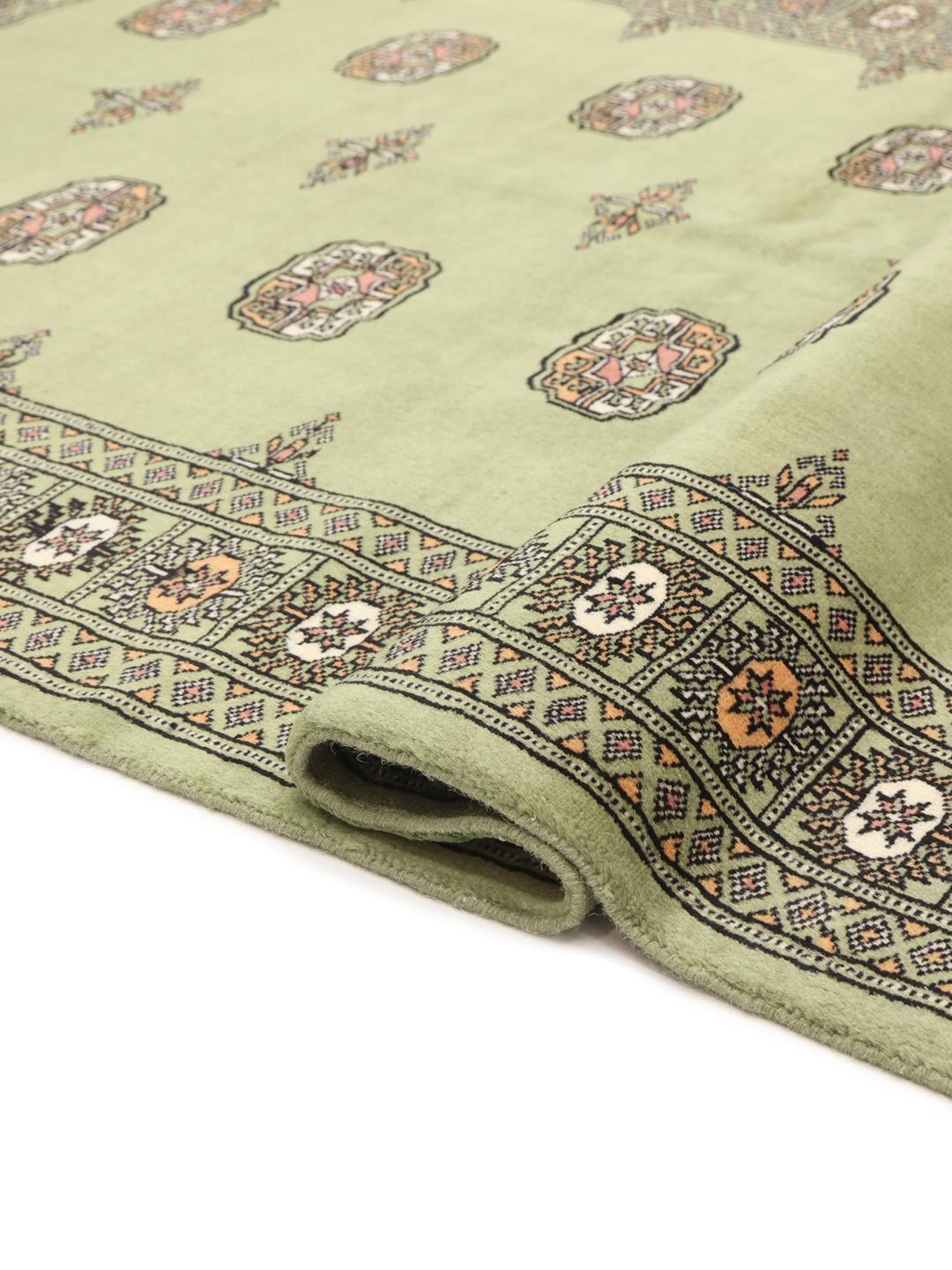 Tapis en laine pakistanaise noué à la main en vert
