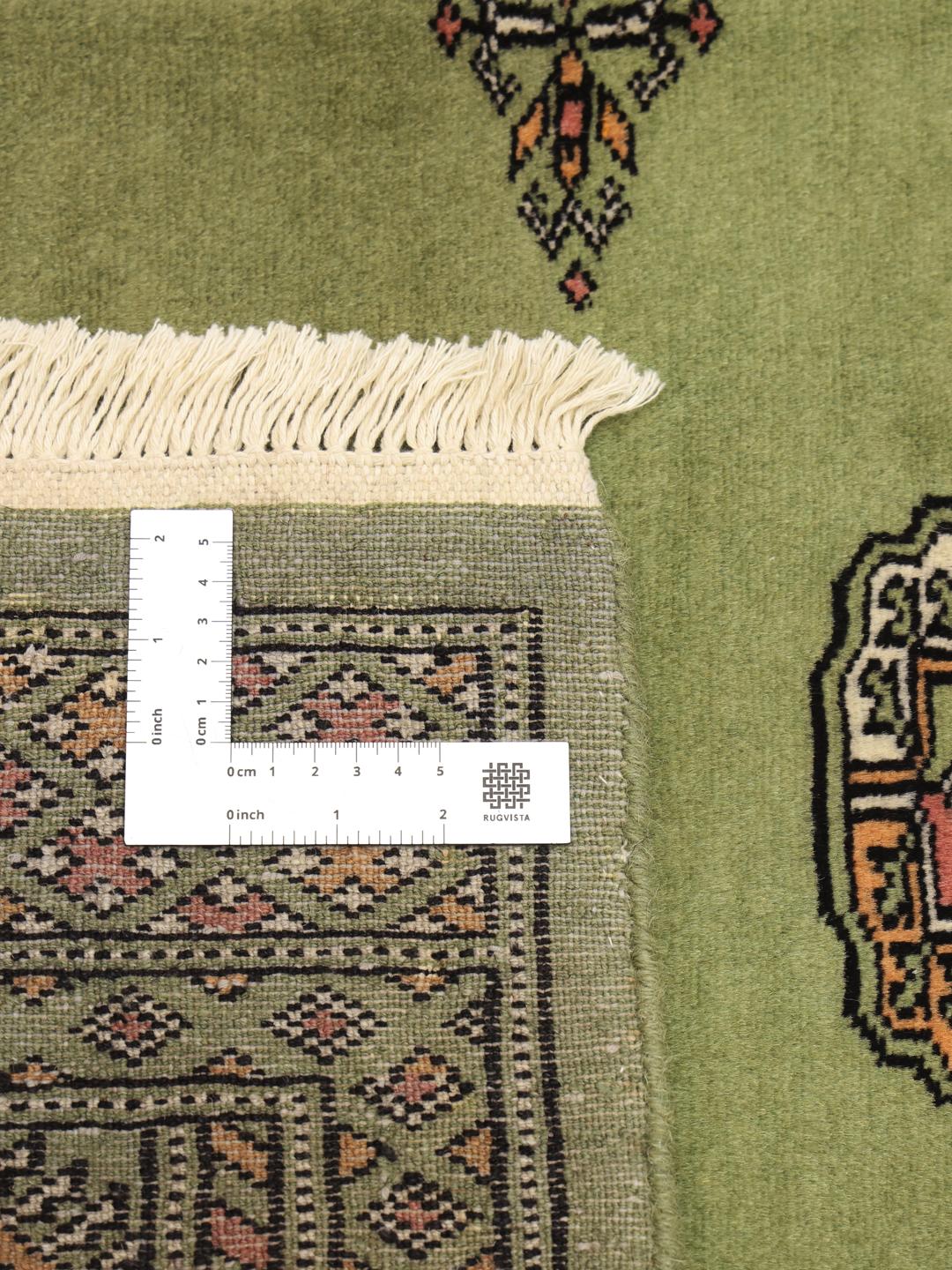 Tapis en laine pakistanaise noué à la main en vert