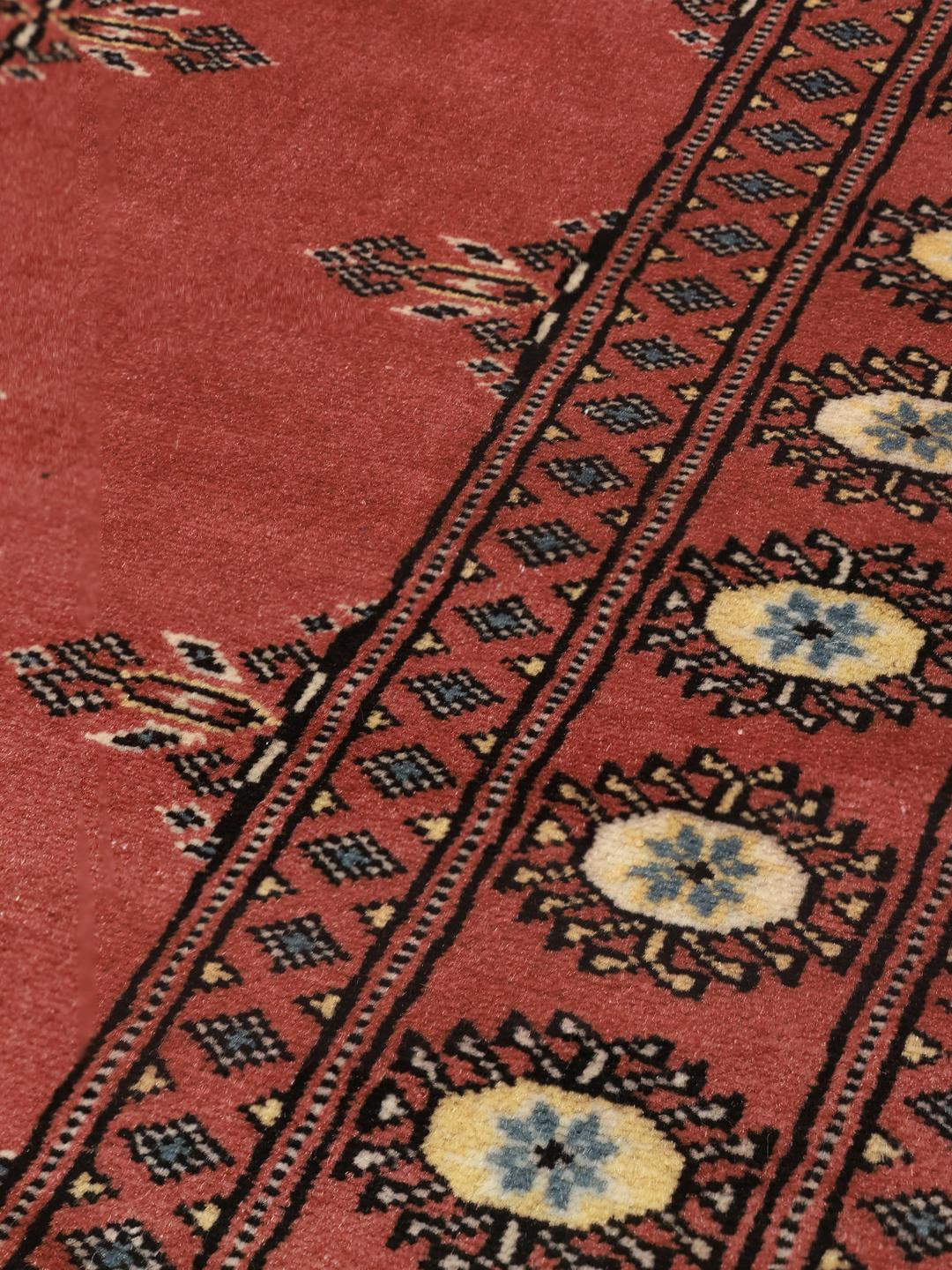 Handmade Pakistan Bokhara 2ply red rug with traditional motifs
