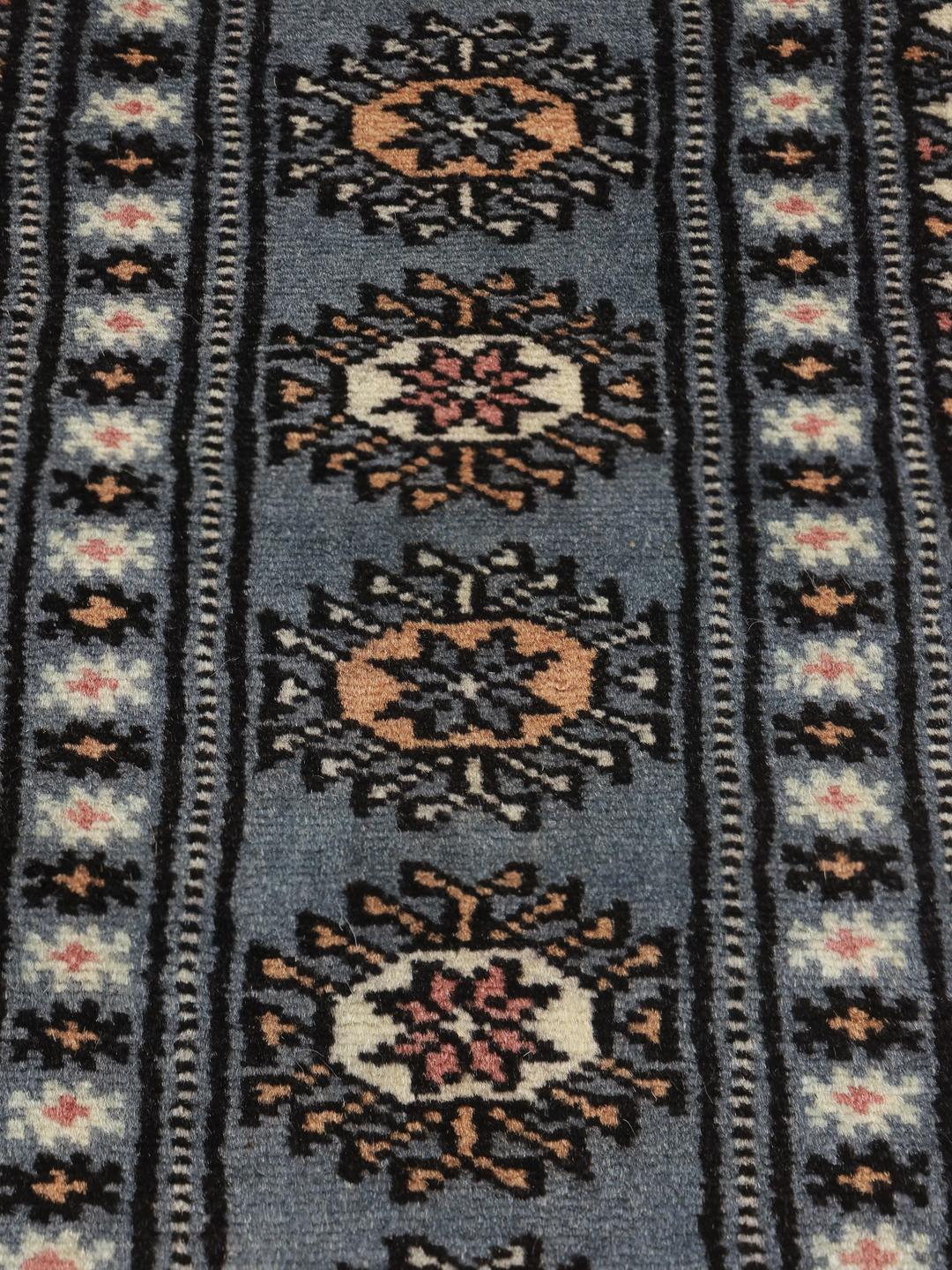 Hand-knotted Pakistan wool rug in blue with traditional patterns