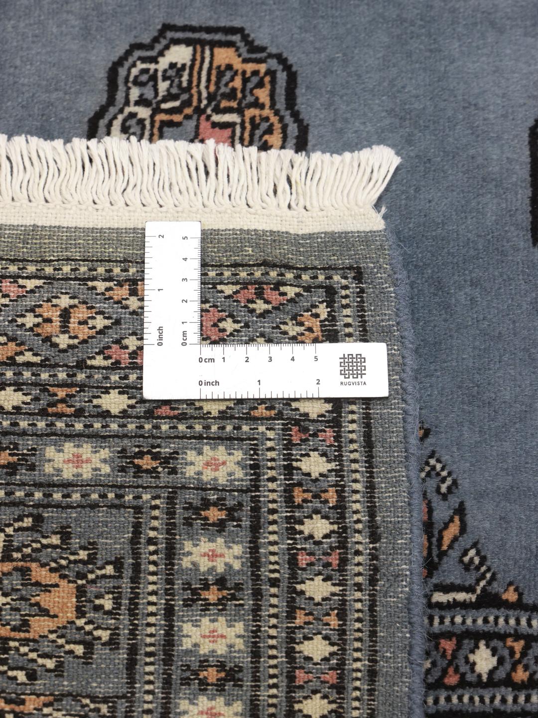 Hand-knotted Pakistan wool rug in blue with traditional patterns