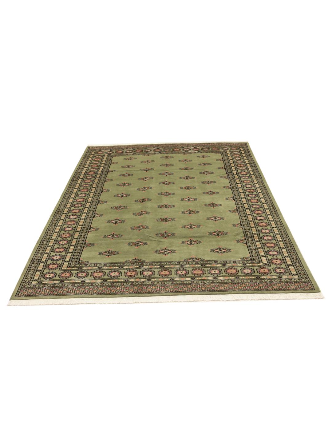 Green Pakistan rug with traditional motifs