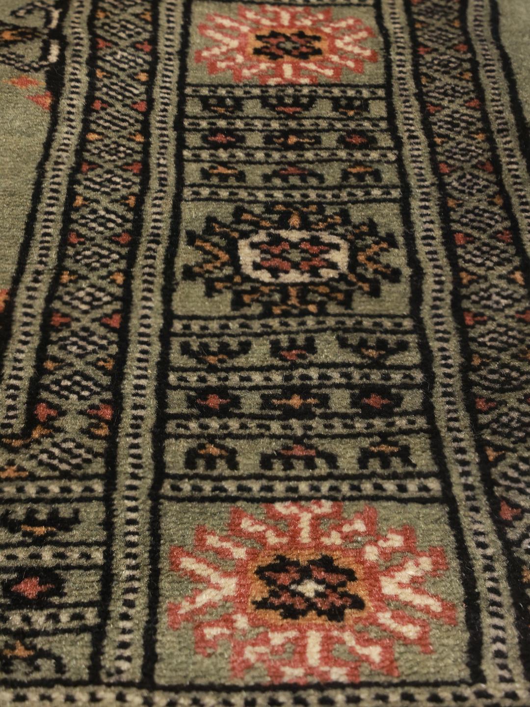 Handmade green Pakistan rug