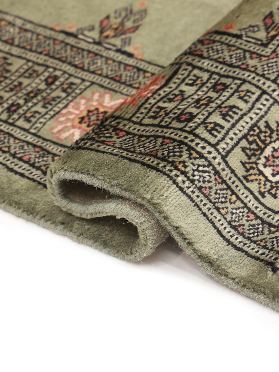 Handmade green Pakistan rug