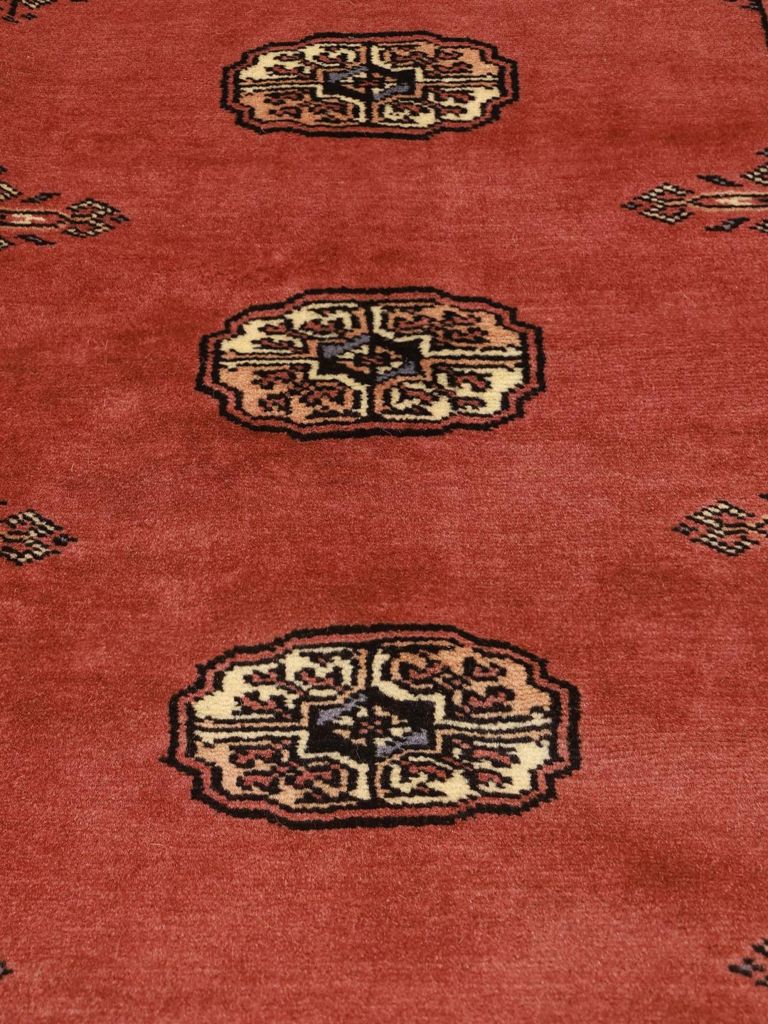 Handmade Pakistan Bokhara rug in red
