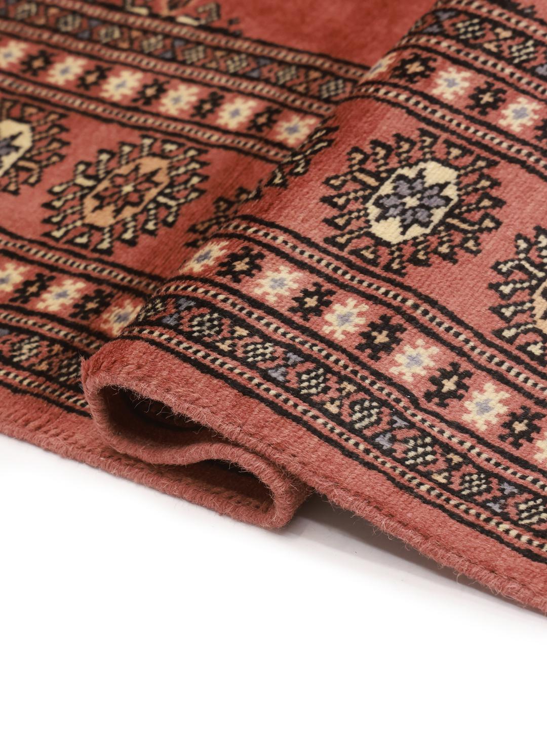 Handmade Pakistan Bokhara rug in red