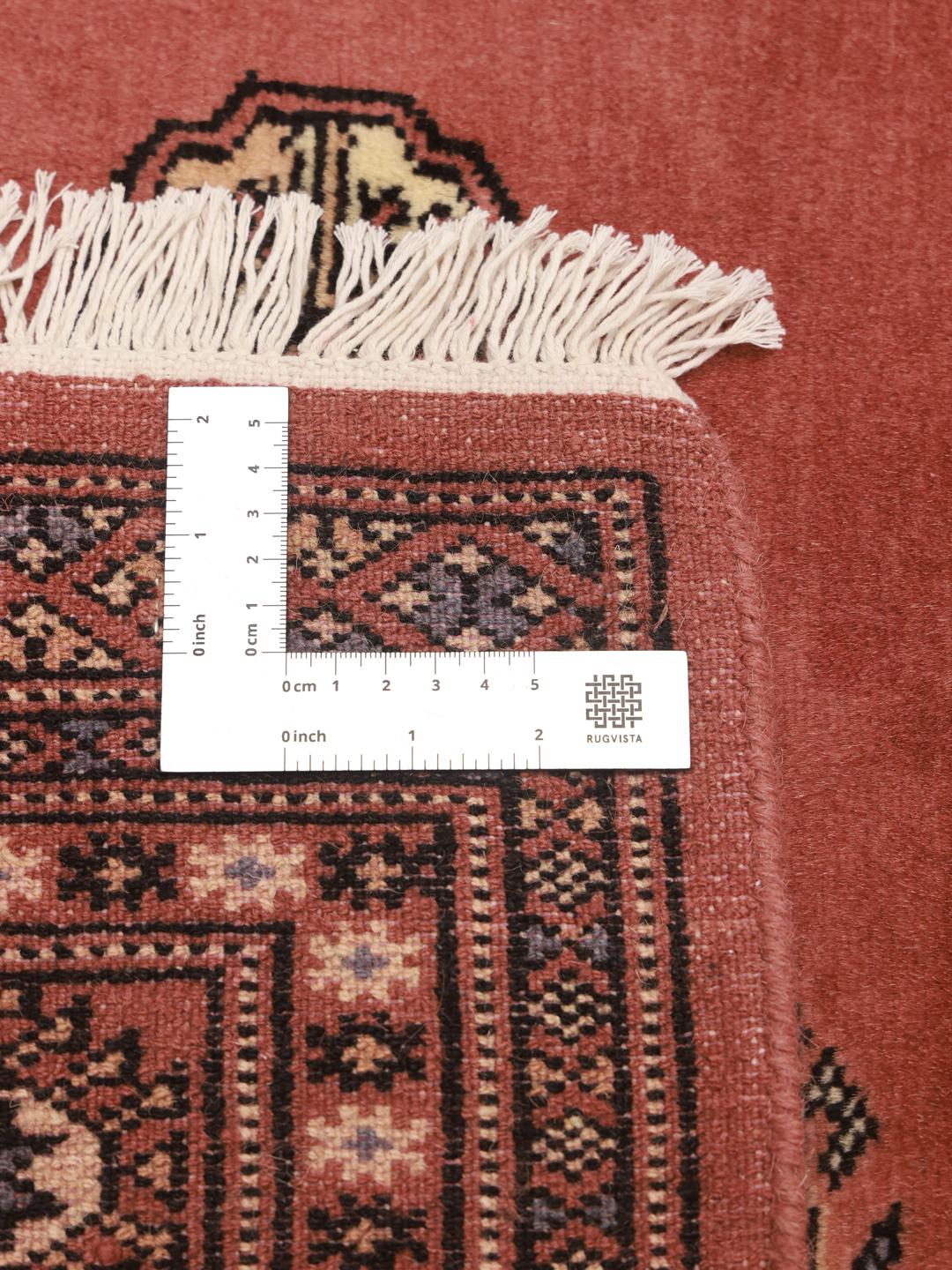 Handmade Pakistan Bokhara rug in red
