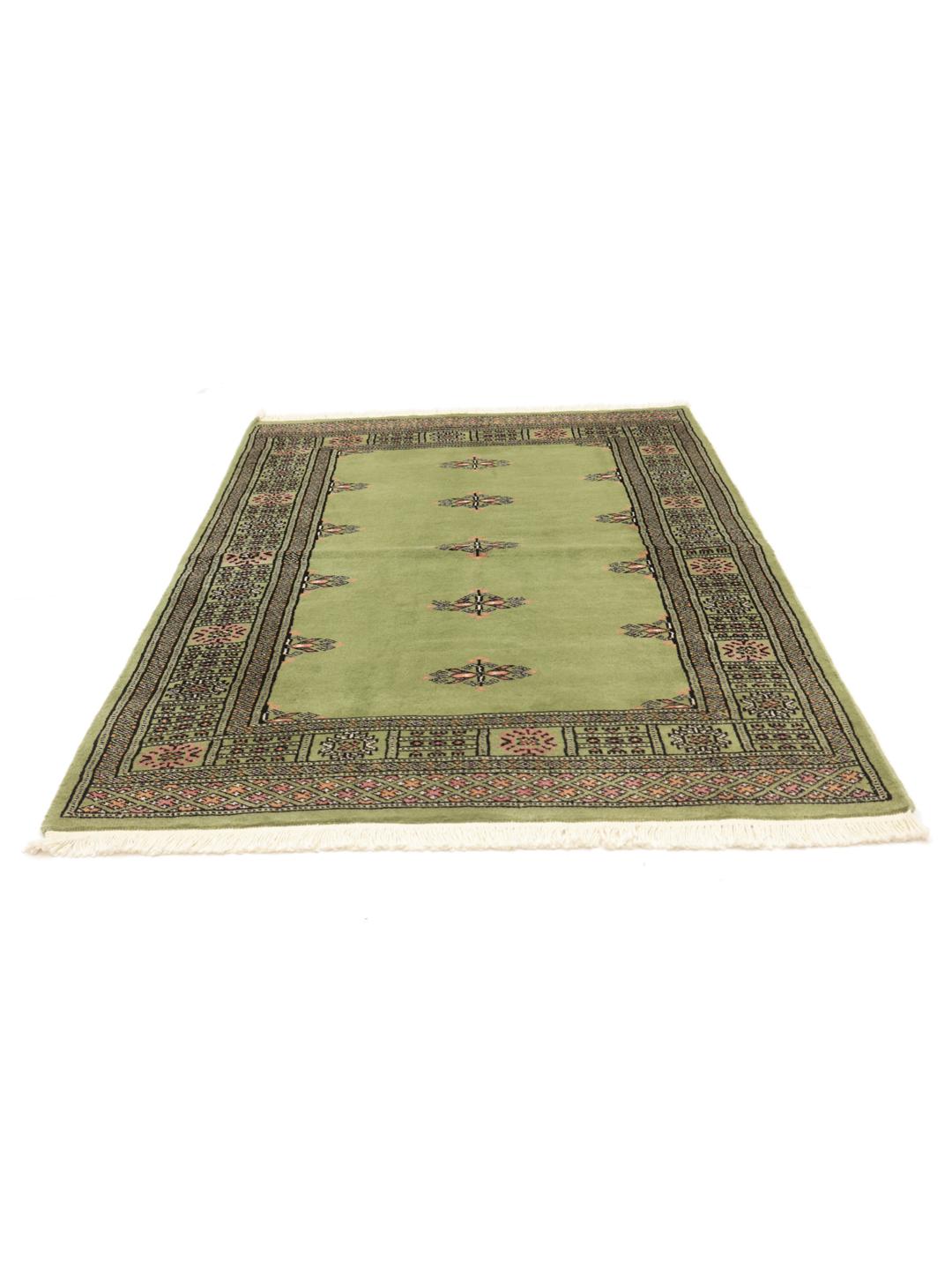 Handmade Pakistan rug in light-green with traditional motifs