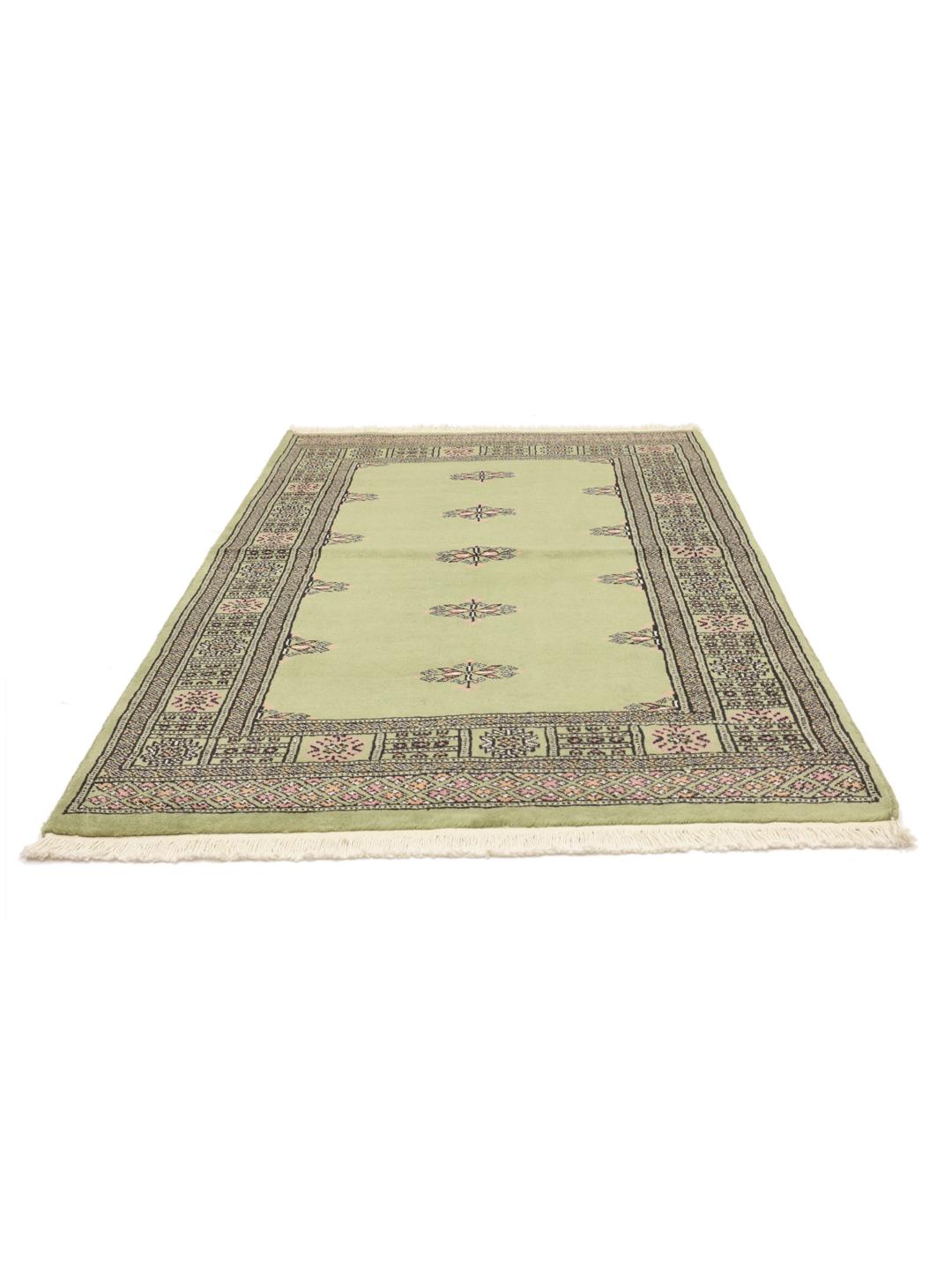 Handmade Pakistan rug in light-green with traditional motifs