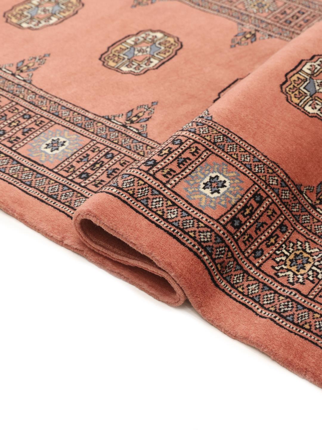 Handmade runner rug from Pakistan in dark red