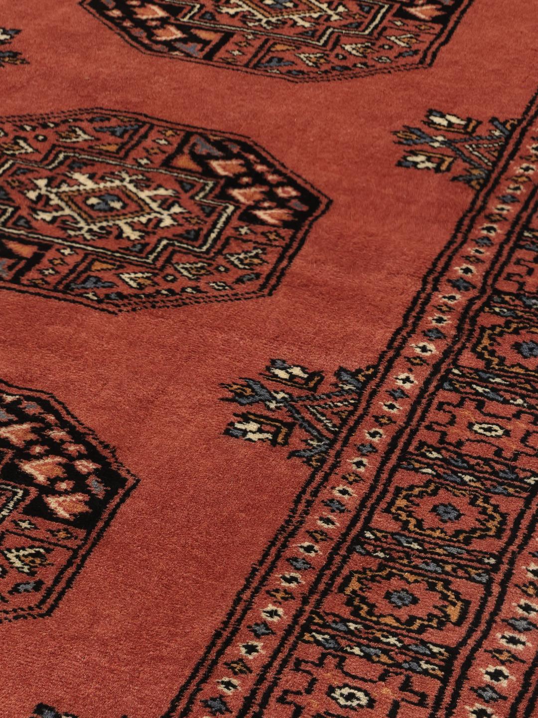 Handmade Pakistan runner rug in dark-red with traditional wool guls