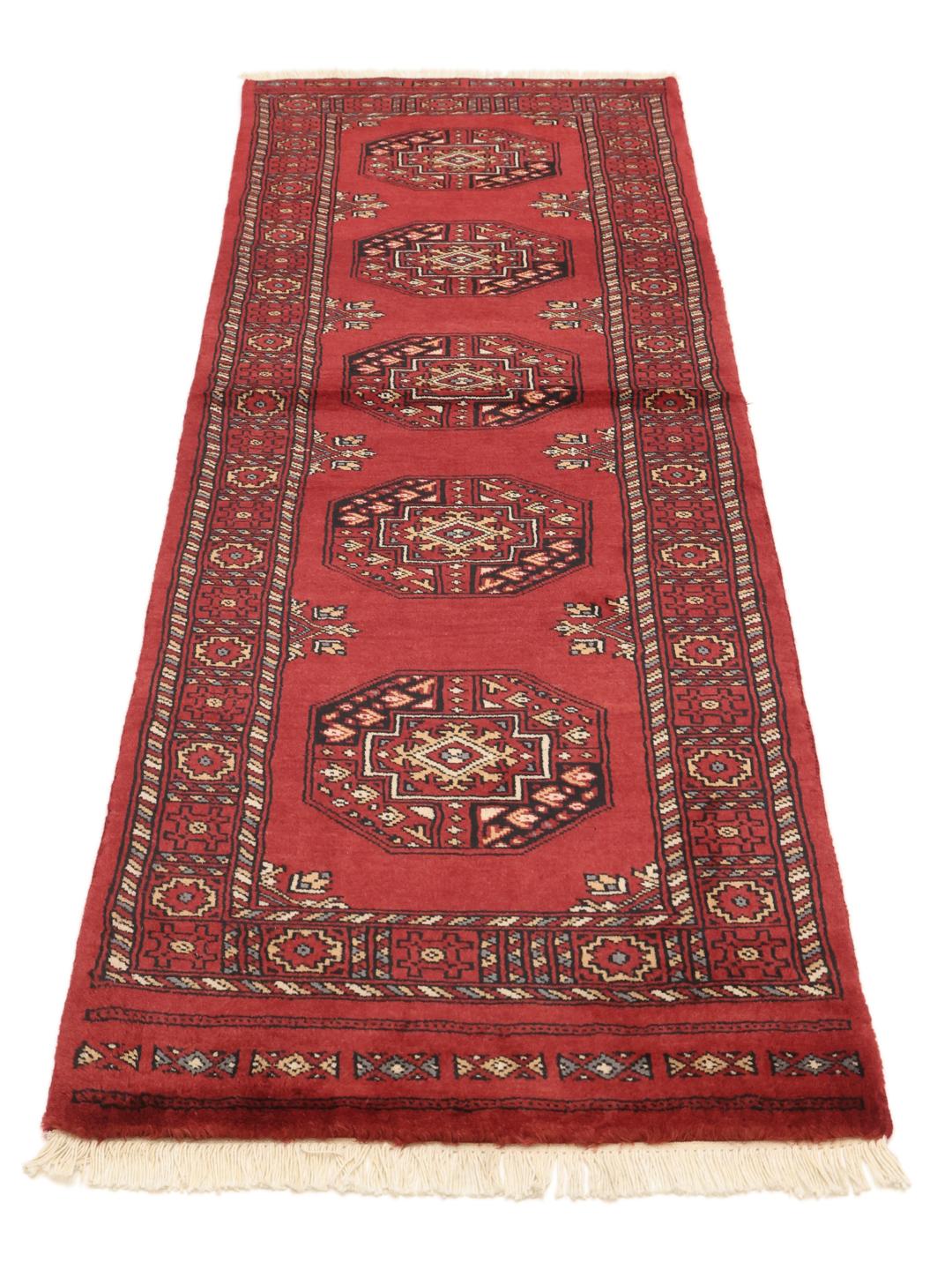 Handmade runner rug from Pakistan in red