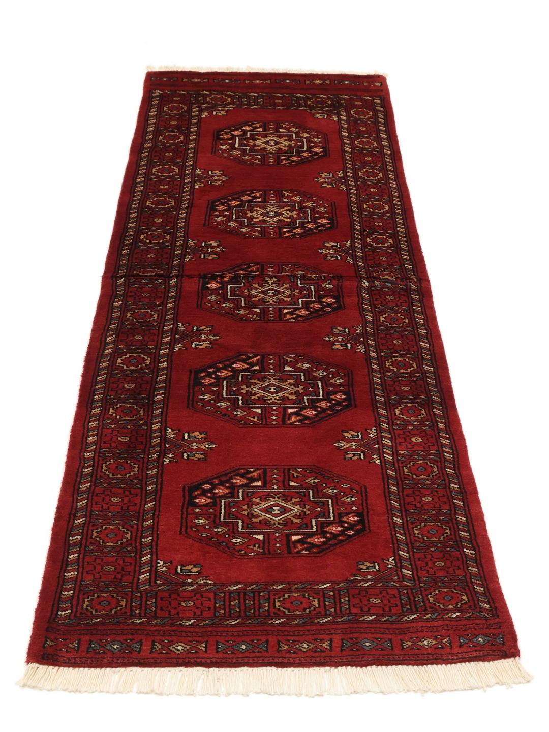 Handmade runner rug from Pakistan in red