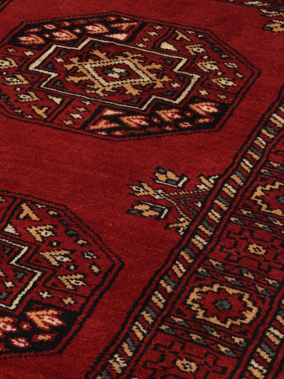 Handmade runner rug from Pakistan in red