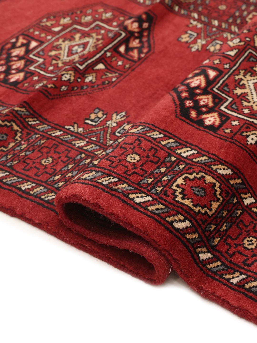 Handmade runner rug from Pakistan in red