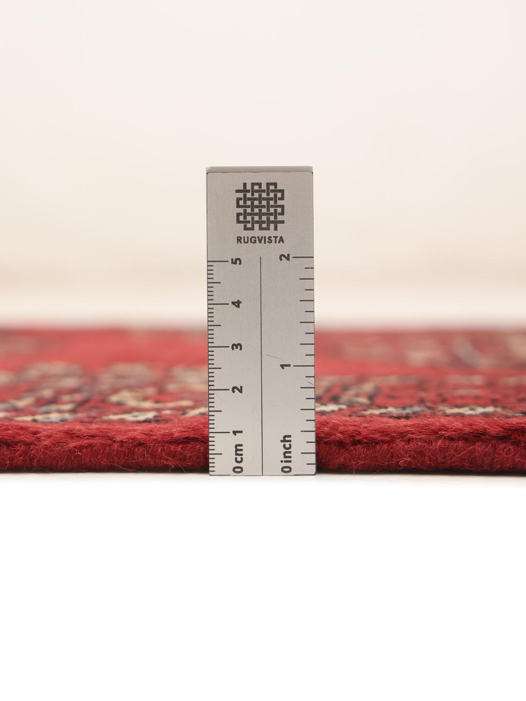 Handmade runner rug from Pakistan in red